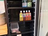 a refrigerator that has a lot of drinks inside of it