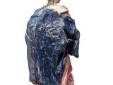 statue of a woman with a blue robe and a pink dress