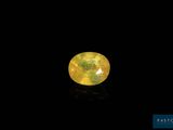 a yellow diamond on a black background
