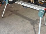 a picture of a workbench in a garage with tools on it