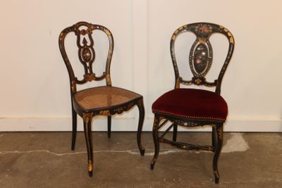 two chairs sitting next to each other in a room