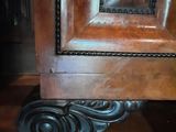 a close up of a door handle on a wooden door