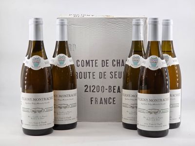 three bottles of wine are sitting in front of a box of wine