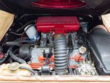 a red engine in the trunk of a car