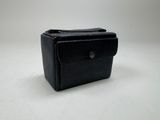 a black purse sitting on top of a white table