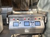 an image of a commercial fryer with two pots on it