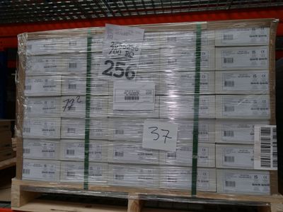 a pallet full of white boxes on a pallet in a warehouse