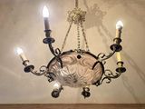 a chandelier hanging from the ceiling in a room
