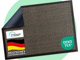 a close up of a black mat with a german flag on it