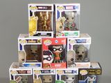 a pile of pop vinyl figures on a table