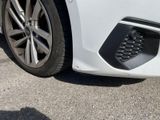 a close up of a car ' s front bumper