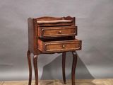 a small wooden table with a drawer on top of it