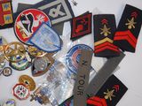 many different types of military patches and badges on the table