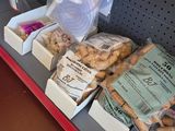 many bags of food on the shelf in the store