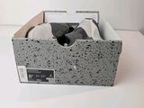 a box with a pair of shoes in it on a table