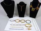 a lot of jewelry on display on the table
