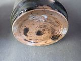 a close up of a coffee cup with a smiley face on it