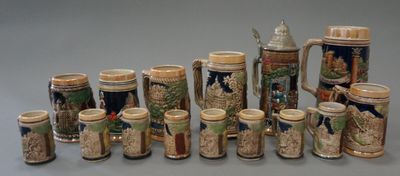a lot of beer mugs that are lined up together