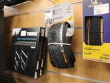 two tires on the wall next to a pair of shoes