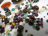 a lot of different colored stones on the table
