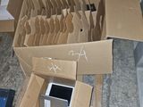 a pile of cardboard boxes with a computer inside of it