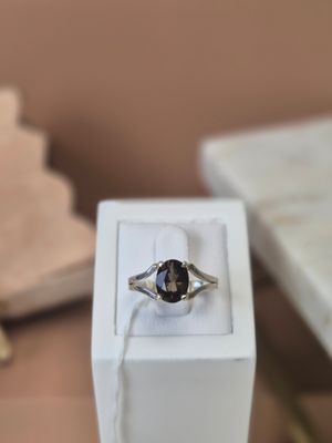 a ring that is sitting in a box on a table