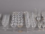a lot of wine glasses that are sitting on a table