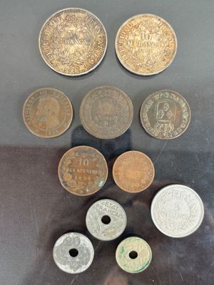 several different coins sitting on top of a table next to each other