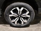 a close up view of a car ' s wheel on the ground
