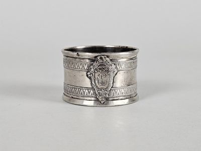 a close up of a silver ring with a lion on it