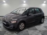 the grey citrole is parked on a checkered tile floor