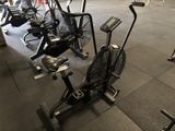 many different types of exercise bikes in a gym