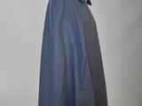 the back view of a blue coat on a mannequin mannequin