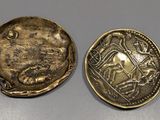 a close up of a coin with a picture of a man on it