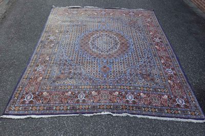 a large rug on the ground in the middle of the street