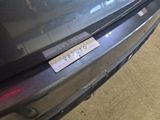 a sticker on the bumper of a car that says vw pluto