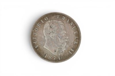 an old coin with a man ' s face on it on a white surface