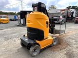 an image of a yellow machine parked in a parking lot