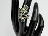 an image of a hand with a ring on it ' s finger