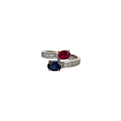 an image of a close up of a ring with a red and blue stone