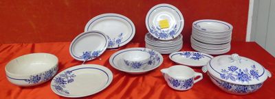 a lot of plates and bowls on the table