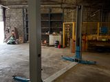 a picture of a garage with a lot of equipment in it