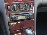 a dashboard of a car with a steering control