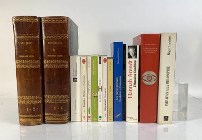 a lot of books that are sitting on a table