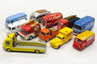 many different types of toy cars and trucks on a white surface