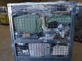 a metal cart with many items in it in a warehouse