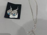 silver plated necklace with a crown and a star charm on it