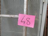 a sign on the door of a building that has a pink sticker on it