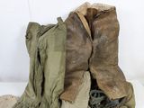 a pair of boots that are sitting next to a pair of boots