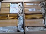 many boxes of boxes of cardboard sitting on a table